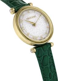 Side profile of Crystalline Wonder watch with gold-tone case and green textured leather strap
