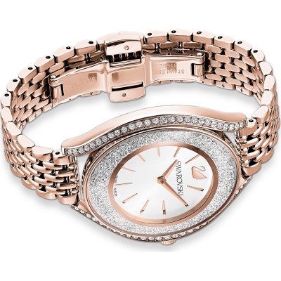 Flat lay top view of rose gold women's watch with crystal bezel and bracelet