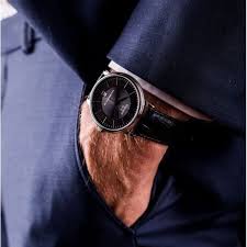 Tissot Carson Automatic watch worn on wrist showing black dial and case design