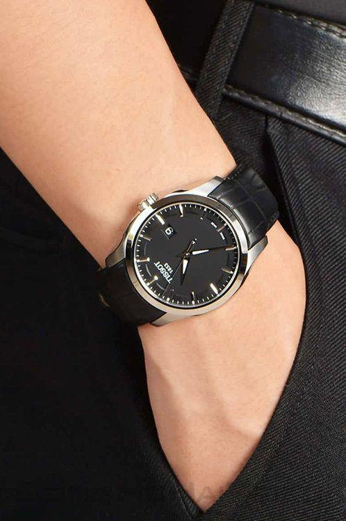 Tissot Couturier watch on wrist showing black leather strap and stainless steel case