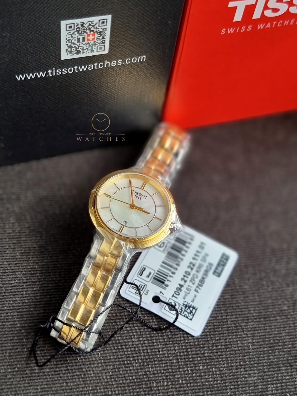 Tissot Flamingo watch with red box, documentation, and authenticity certificate