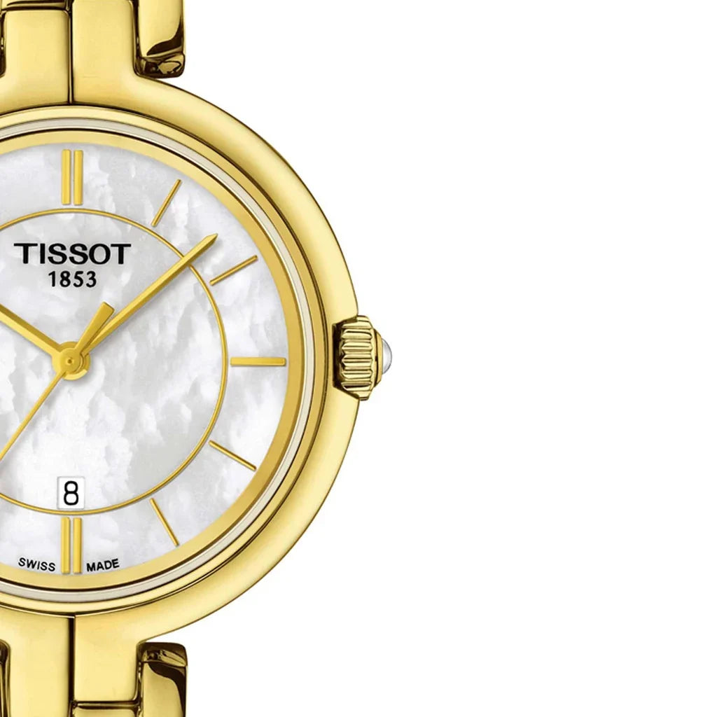 Close-up of Tissot Flamingo mother-of-pearl dial with gold hour markers and hands