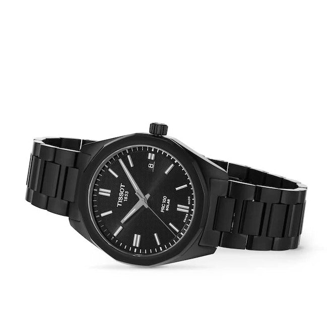 Tissot PRC100 Solar black watch on wrist with stainless steel bracelet