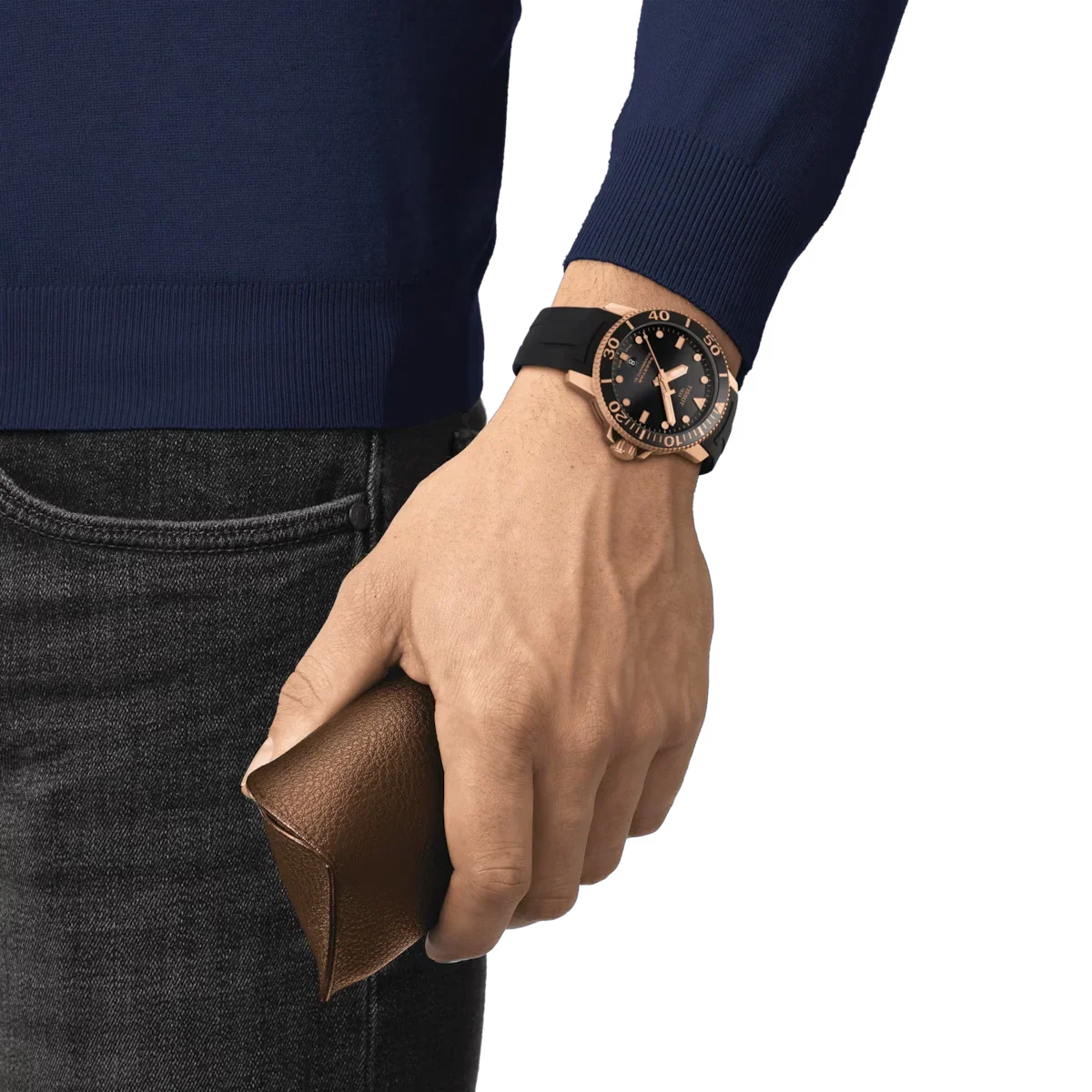 Tissot Seastar 1000 Powermatic 80 watch worn on wrist with black rubber strap