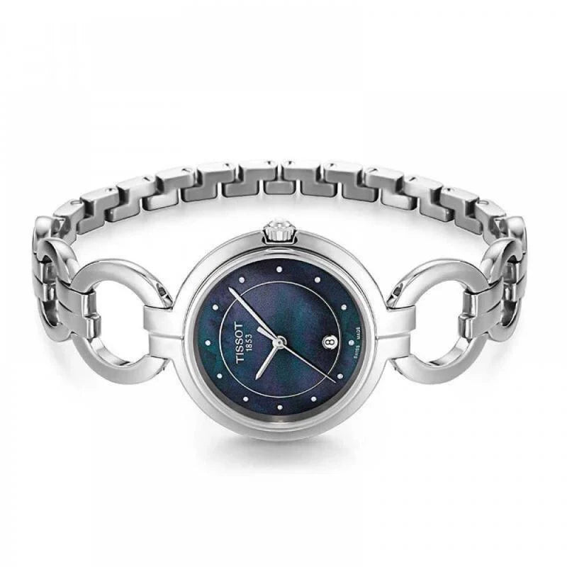 Tissot T-Lady Flamingo watch on wrist, showing linked stainless steel bracelet and round case