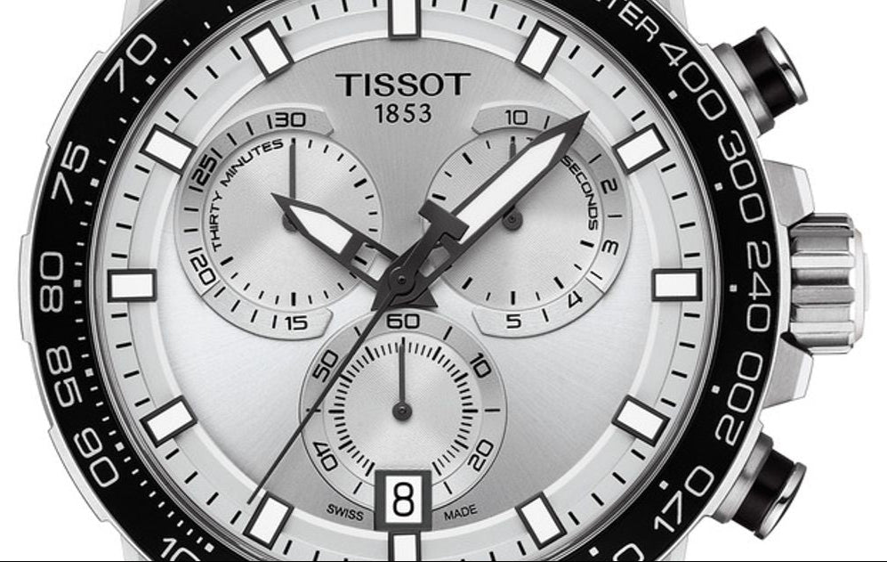 Tissot chronograph dial detail with subdials, 1853 logo, and tachymeter scale