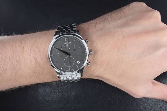 Tissot Tradition Chronograph worn on wrist showing dark dial and steel bracelet