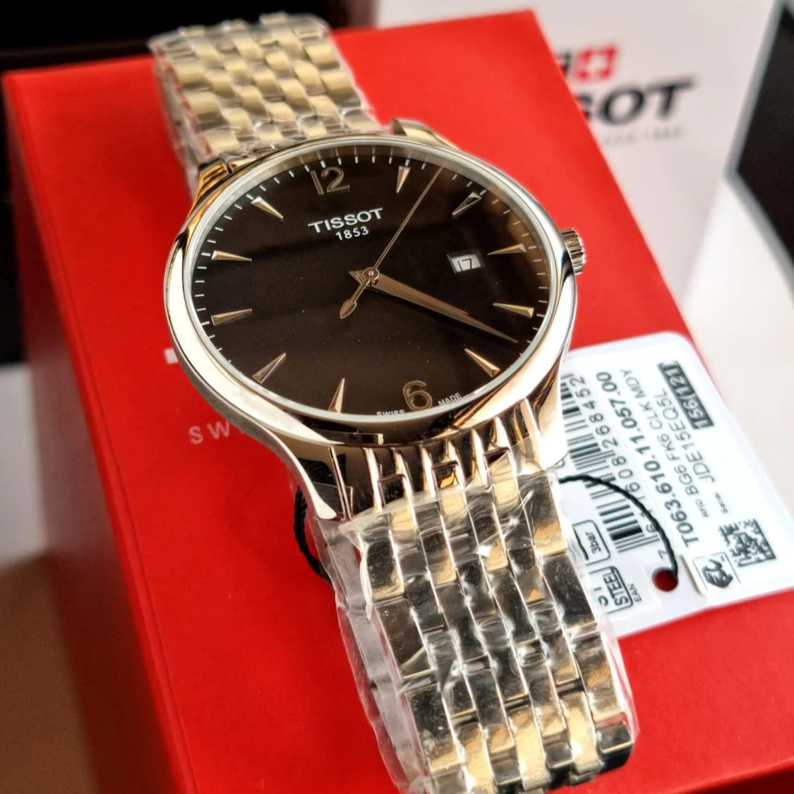 Tissot Tradition watch with red Tissot box and warranty card