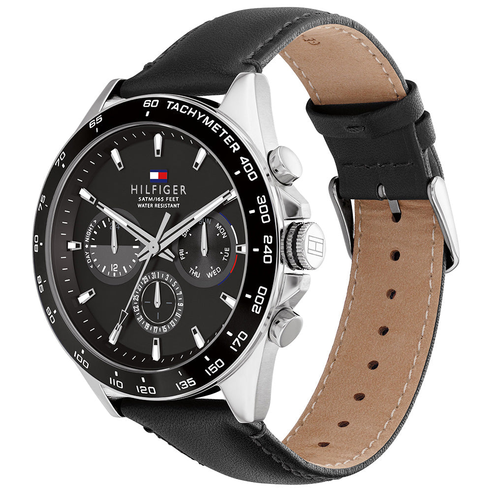 Side angle view of Tommy Hilfiger Owen watch showing black leather strap with tan lining