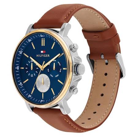 Side angle view of Tommy Hilfiger watch showing brown leather strap and multi-function dial