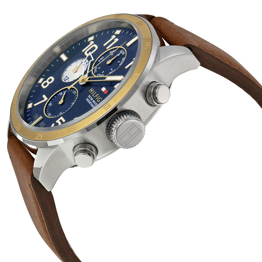 Side view of Tommy Hilfiger chronograph with silver case, navy dial, and brown leather strap