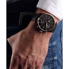 Tommy Hilfiger 1791273 chronograph watch on wrist showing rose gold case and black leather strap