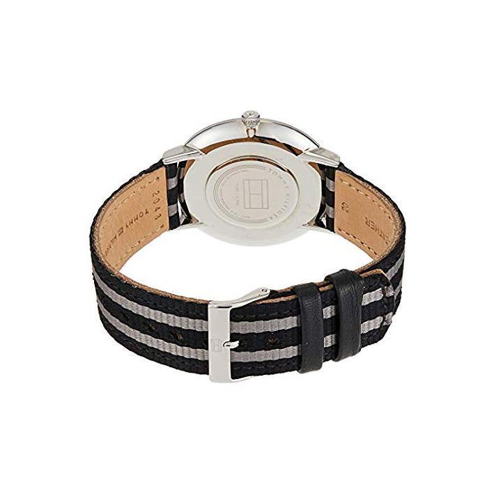 Rear view of Tommy Hilfiger watch showing caseback and striped fabric strap detail