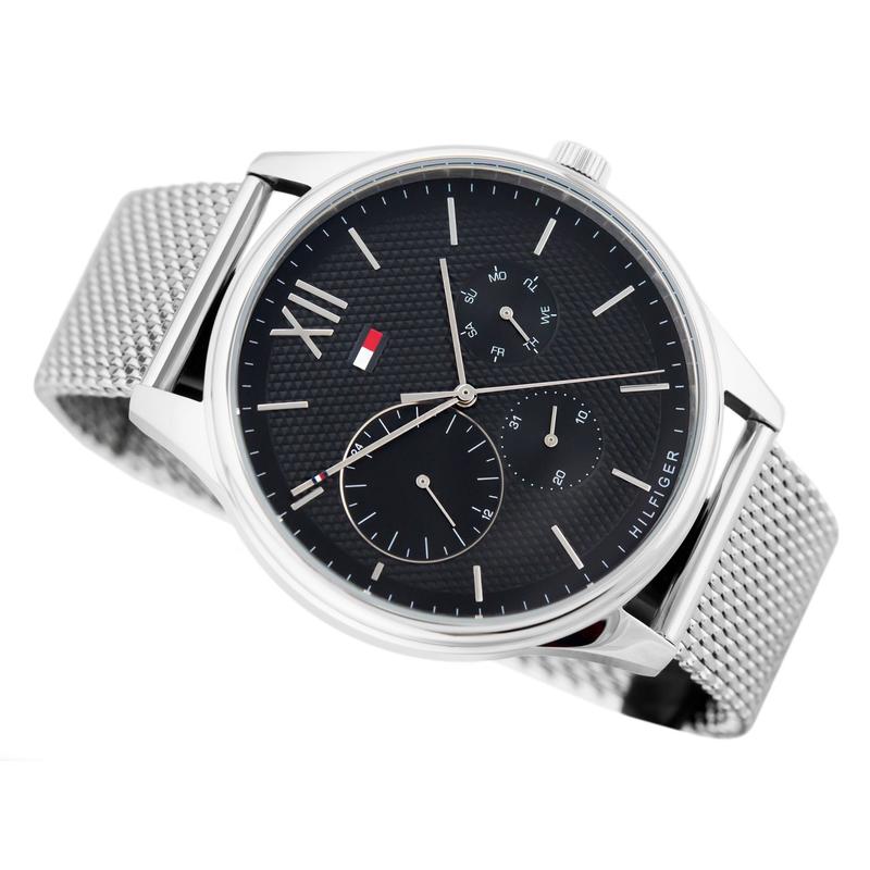 Three-quarter view of Tommy Hilfiger chronograph watch with mesh band showing dial detail and case