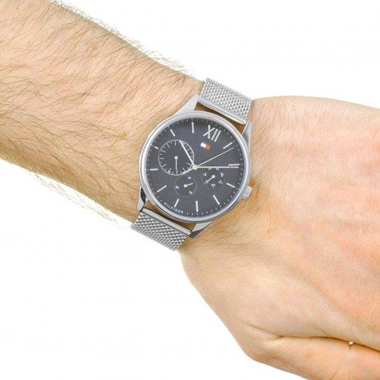 Tommy Hilfiger chronograph watch with mesh band worn on wrist, showing dial and case side view