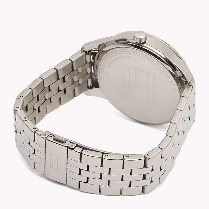 Caseback of Tommy Hilfiger watch showing silver-tone stainless steel cover