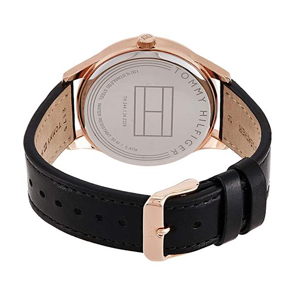 Tommy Hilfiger watch caseback showing engraved Tommy Hilfiger branding and stainless steel construction