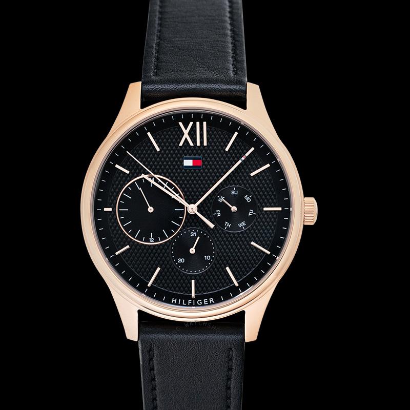 Close-up of watch dial featuring multi-dial chronograph subdials, Roman numerals, and Tommy Hilfiger logo