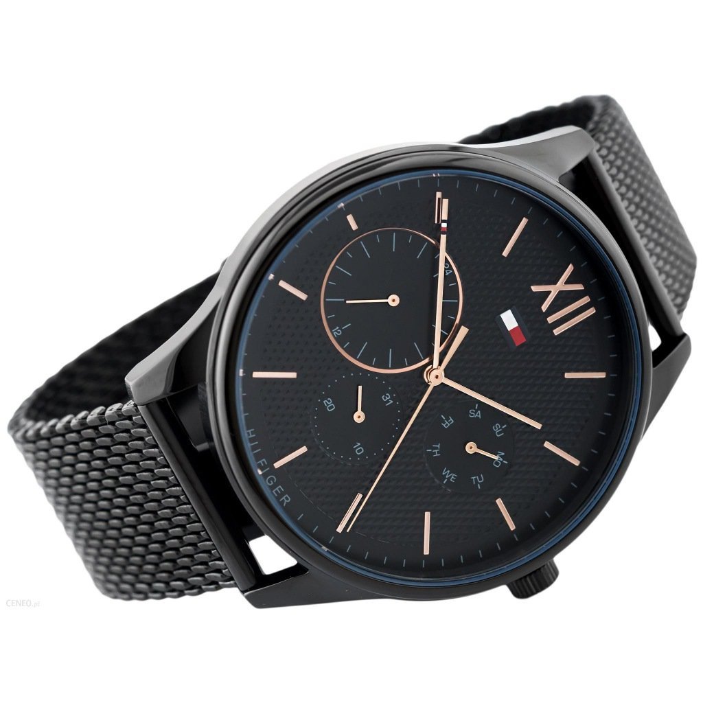 All-black chronograph watch on angle with black mesh strap and subdials