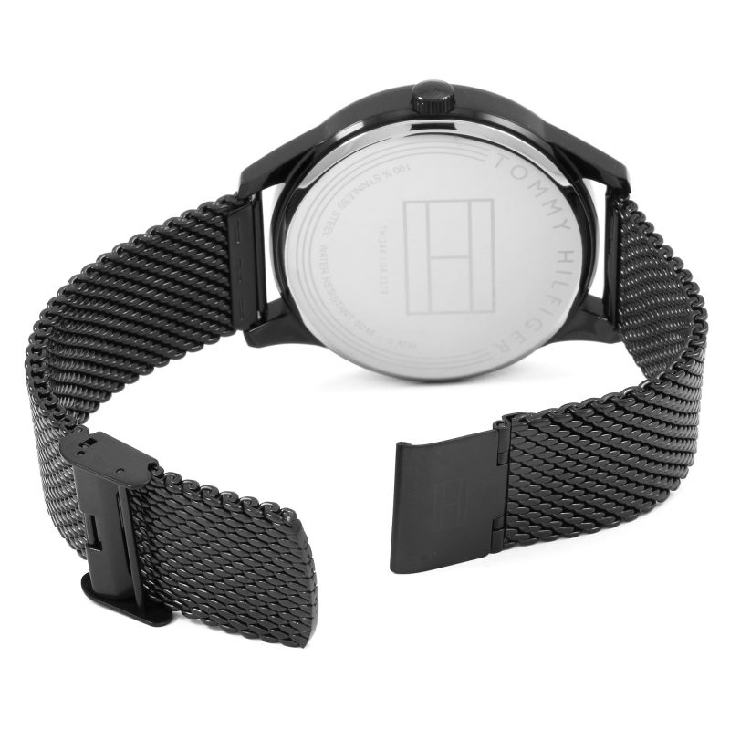 Back side of black watch case with mesh strap and deployment clasp
