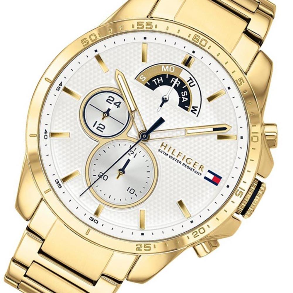 Tommy Hilfiger gold steel multi-function watch angled view showing white dial and gold steel bracelet