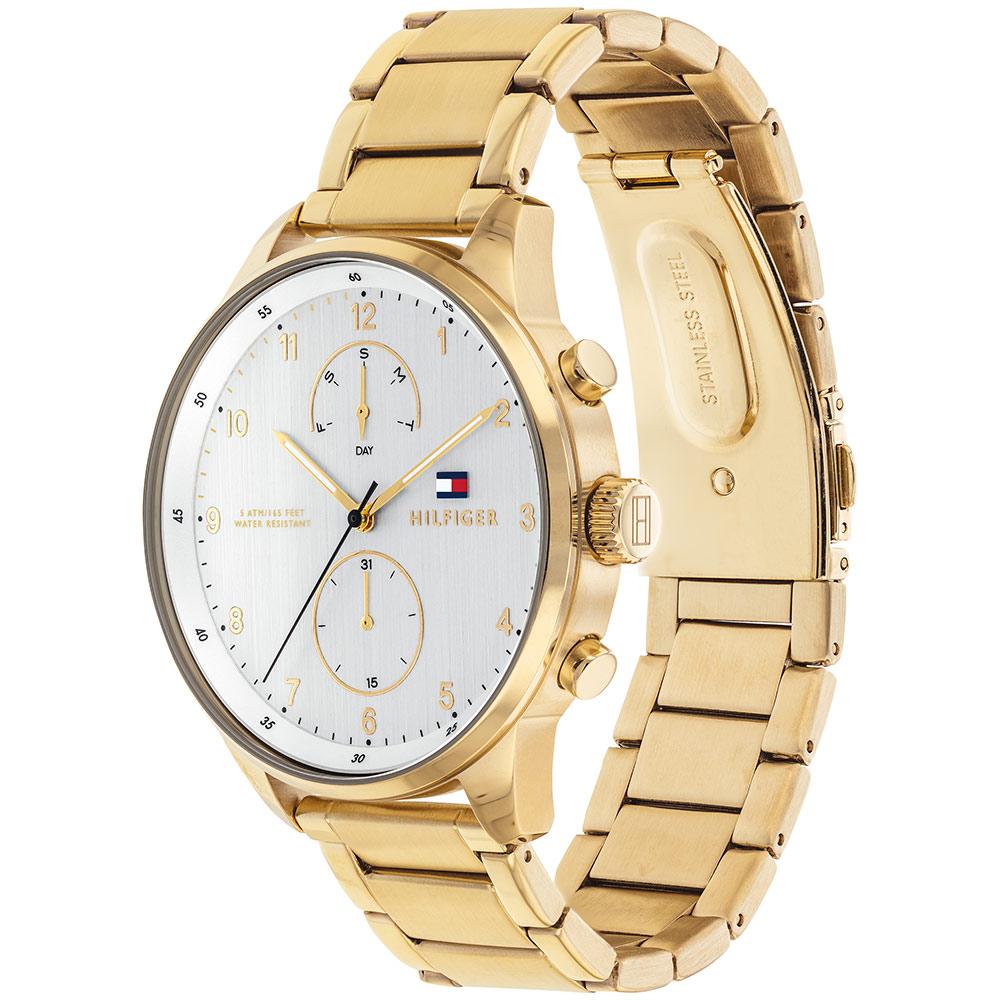 Side angle view of golden Tommy Hilfiger watch with extended golden bracelet strap