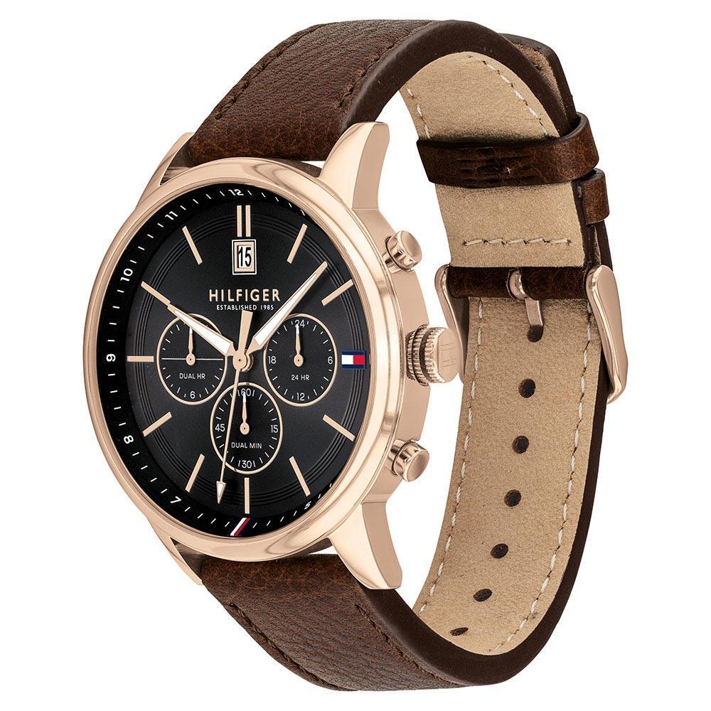 Side angle view of Tommy Hilfiger chronograph watch showing brown leather strap and rose-gold case