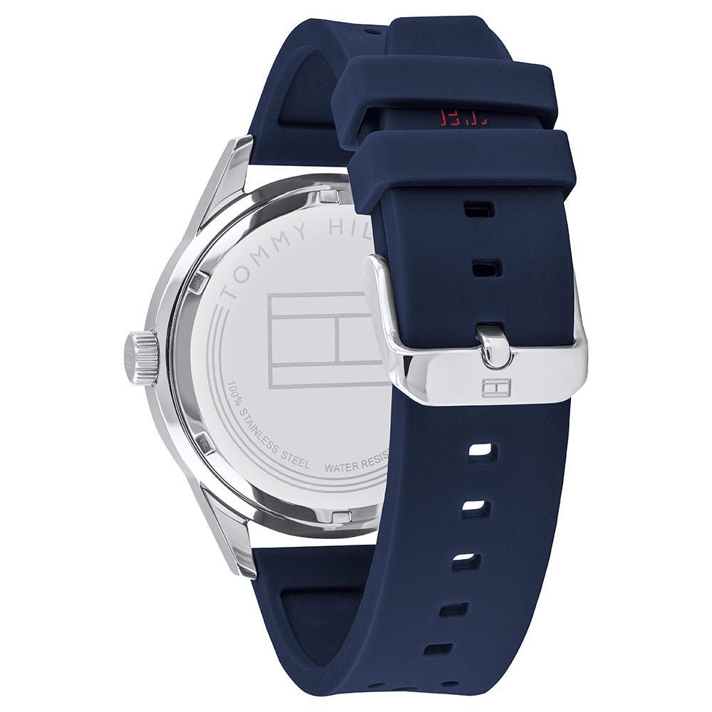 Side view of Tommy Hilfiger watch showing stainless steel case profile and navy silicone band