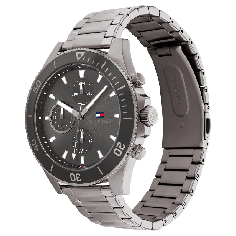 Tommy Hilfiger chronograph watch displayed at angle showing dial and metal bracelet