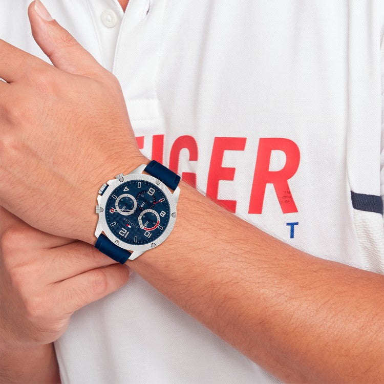 Tommy Hilfiger chronograph watch worn on wrist showing blue dial and white case