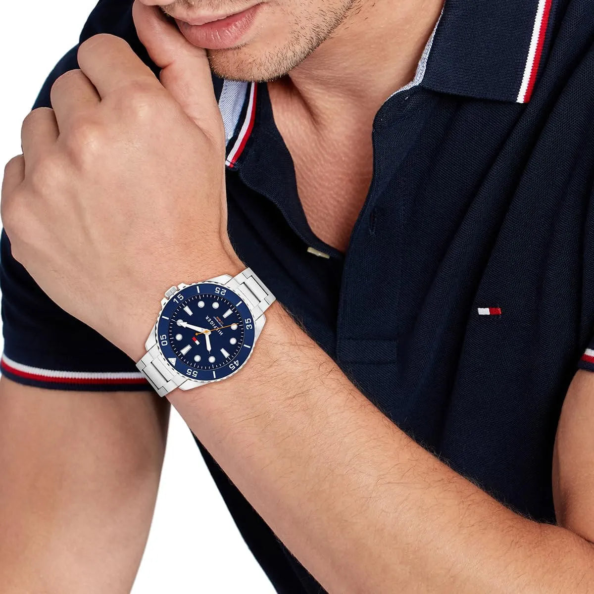 Tommy Hilfiger Oceanic watch on wrist with blue dial and white hour markers visible