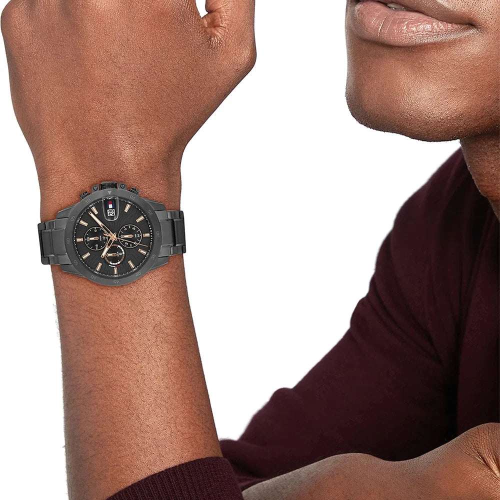 Tommy Hilfiger JAMESON chronograph watch worn on wrist with dark grey case and bracelet