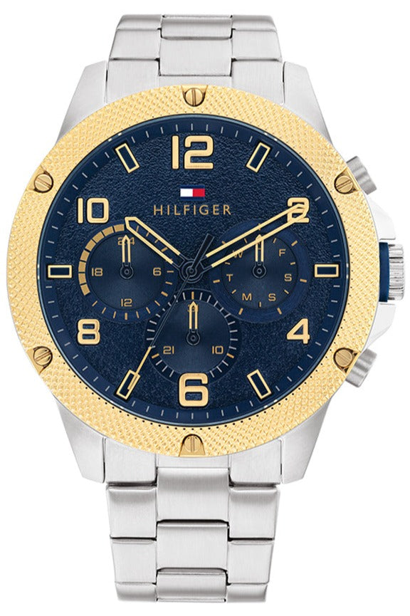 Tommy Hilfiger Blaze chronograph watch with blue dial, gold bezel, and silver steel bracelet
