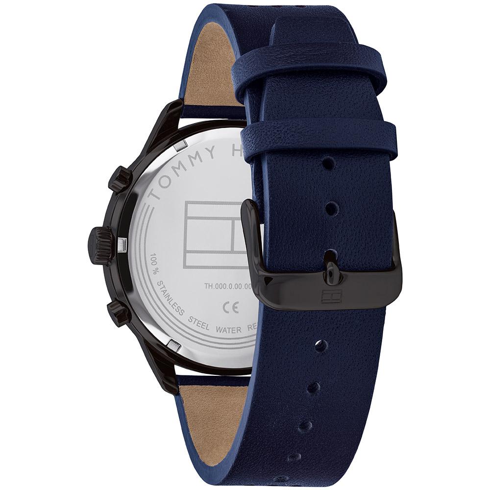 Watch caseback showing Tommy Hilfiger branding, water resistance, and blue leather strap