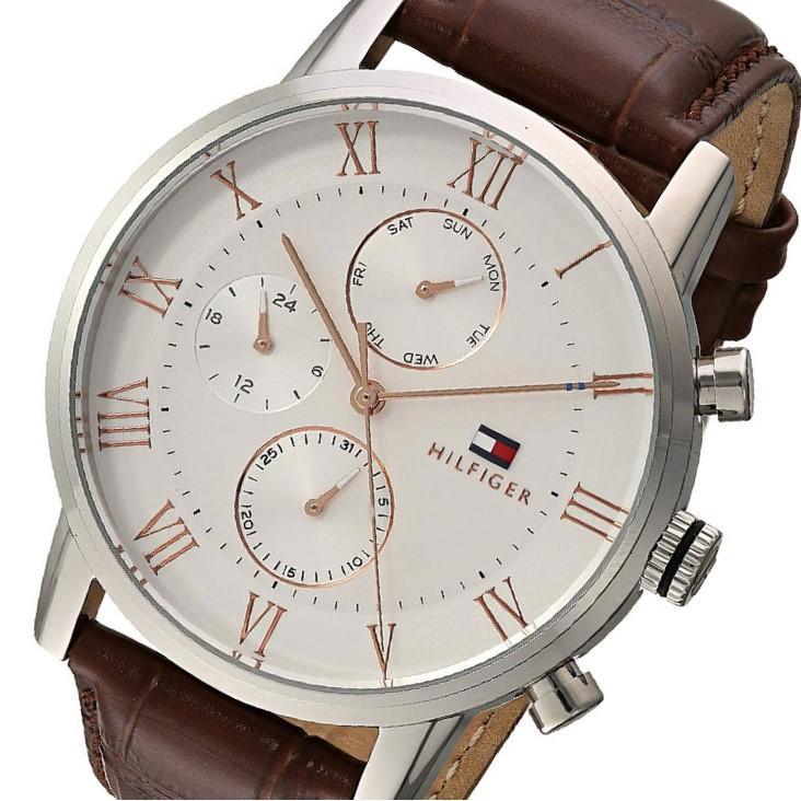 Close-up of silver dial showing Roman numerals and dual chronograph subdials