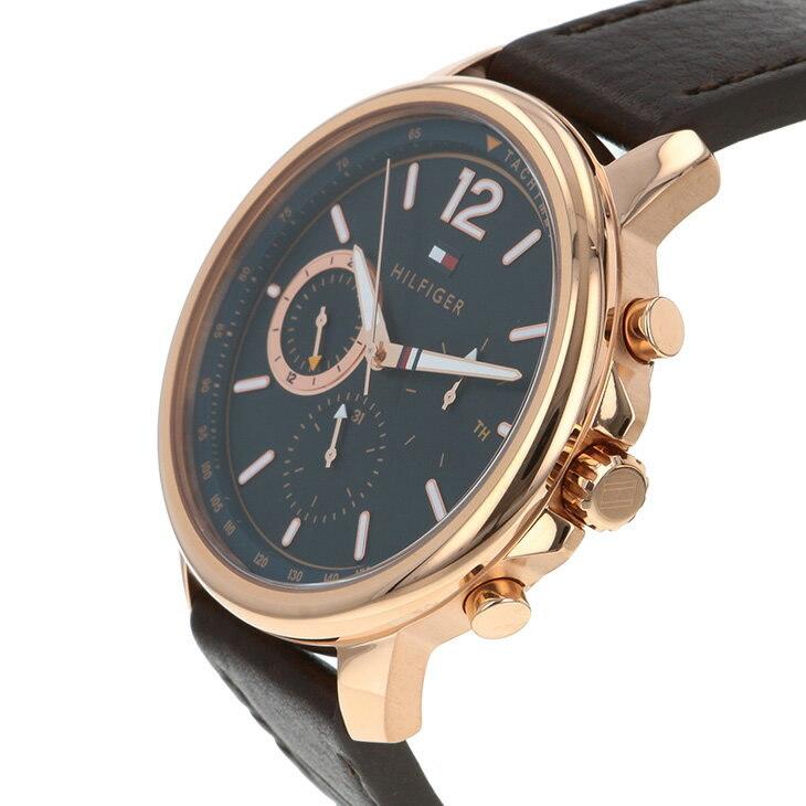 Side angle view of Tommy Hilfiger chronograph with blue dial and rose gold case on wrist