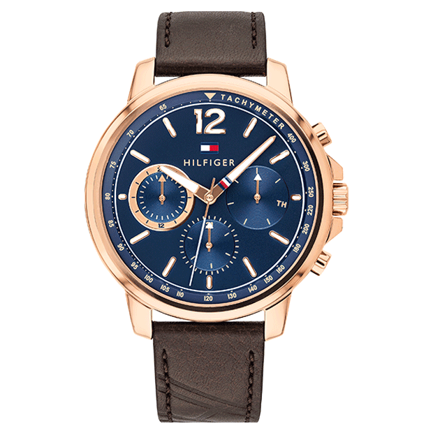 Tommy Hilfiger chronograph watch with blue dial, rose gold case, and brown leather strap