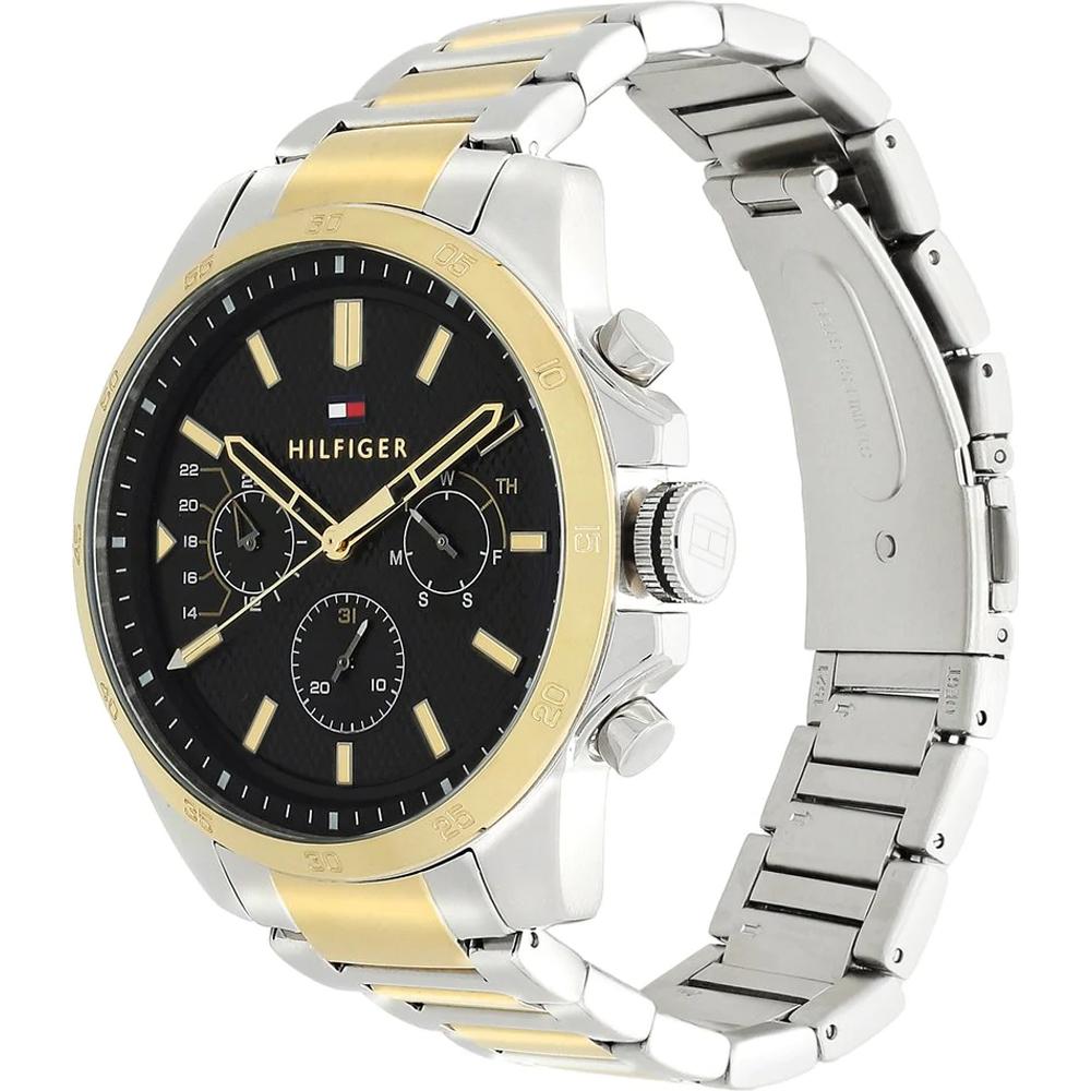 Tommy Hilfiger watch showing dual-tone steel and gold strap with gold bezel from side angle