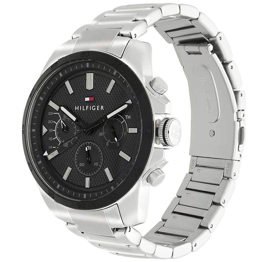 Tommy Hilfiger Iconic watch angled view showing black dial, case and stainless steel bracelet