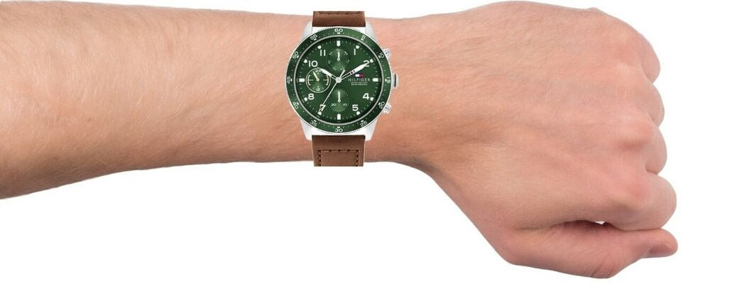 Tommy Hilfiger Jimmy men's watch worn on wrist showing green chronograph dial