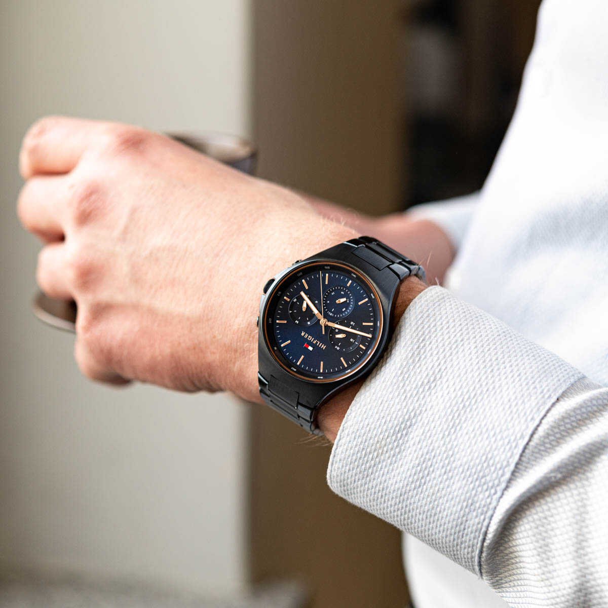 Tommy Hilfiger Justin men's watch displayed on wrist in lifestyle setting