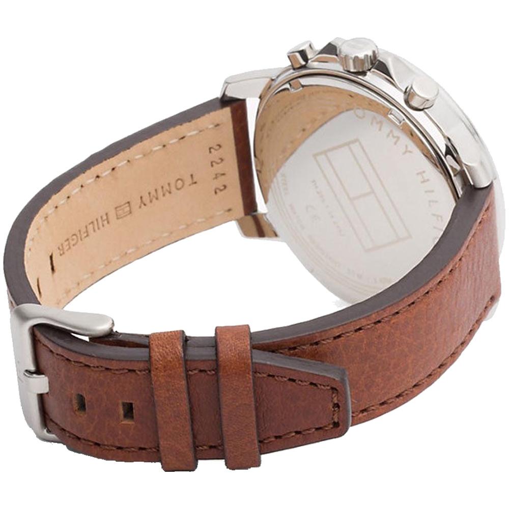 Brown leather strap with visible stitching and stainless steel buckle on Tommy Hilfiger watch