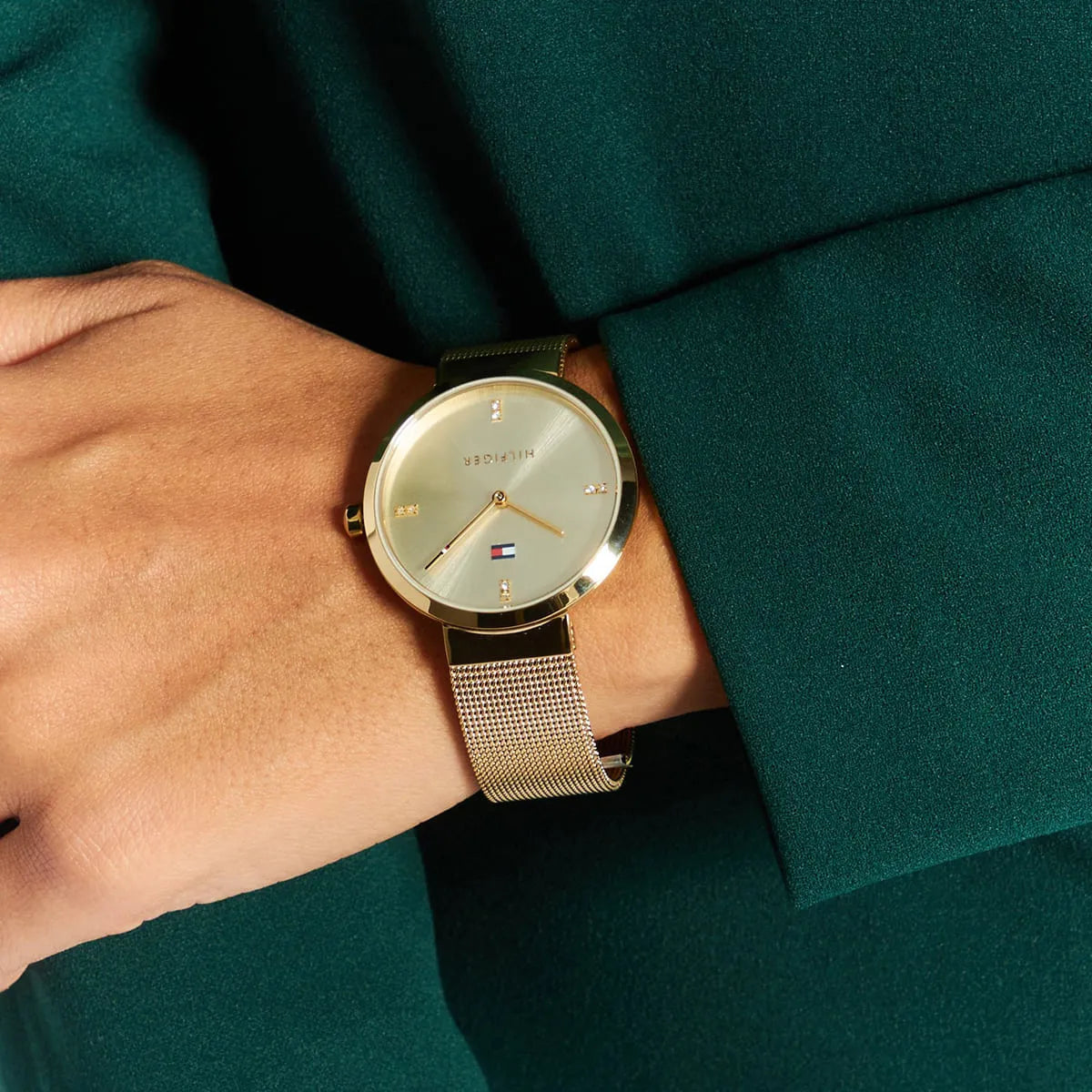 Tommy Hilfiger Liberty watch worn on wrist with gold mesh strap