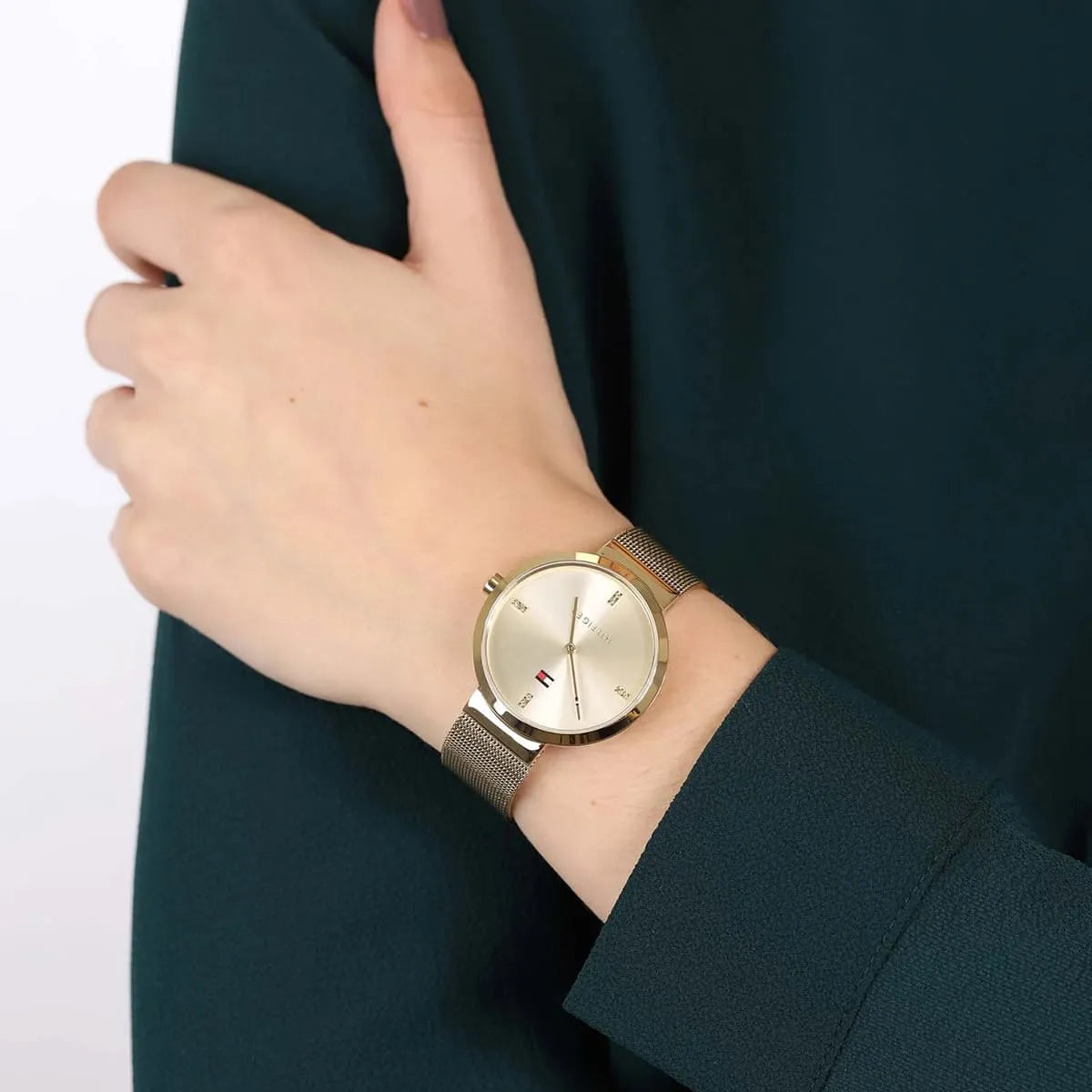 Tommy Hilfiger Liberty women's watch worn on wrist with gold mesh band