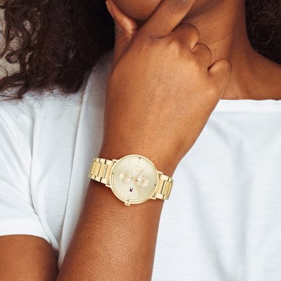 Tommy Hilfiger Liberty gold watch worn on wrist with cream dial