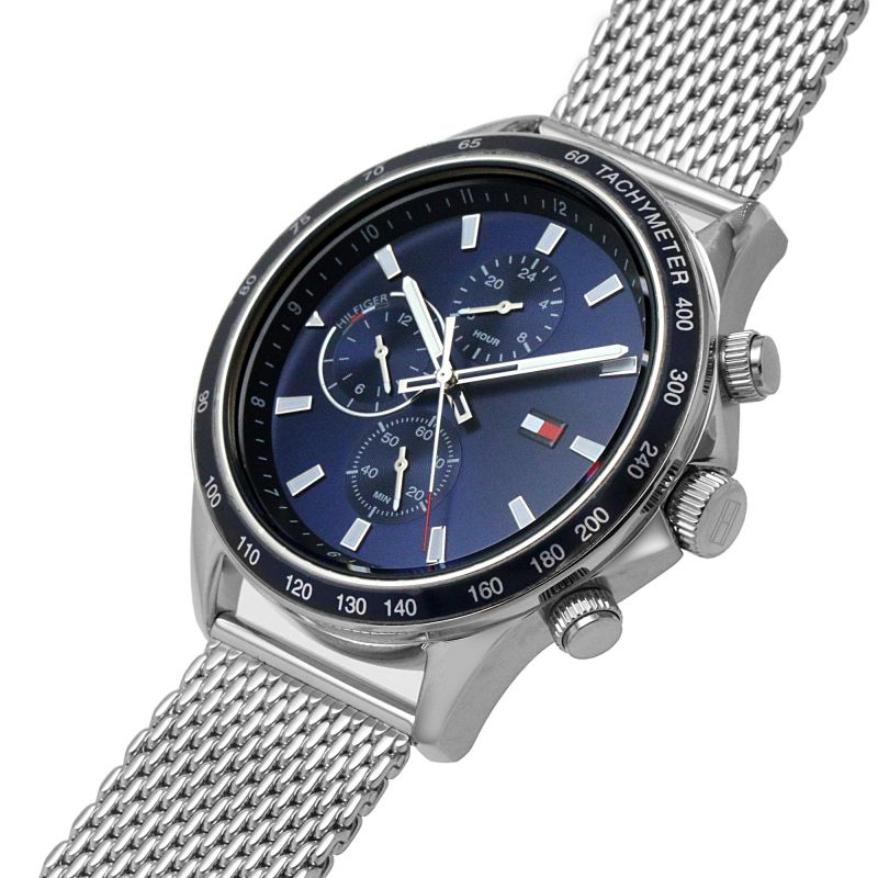Tommy Hilfiger Miles watch at angle showing mesh strap, silver case, and chronograph subdials