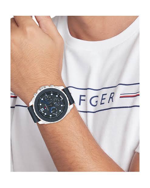Tommy Hilfiger Morgan blue multifunction watch worn on wrist with navy rubber strap
