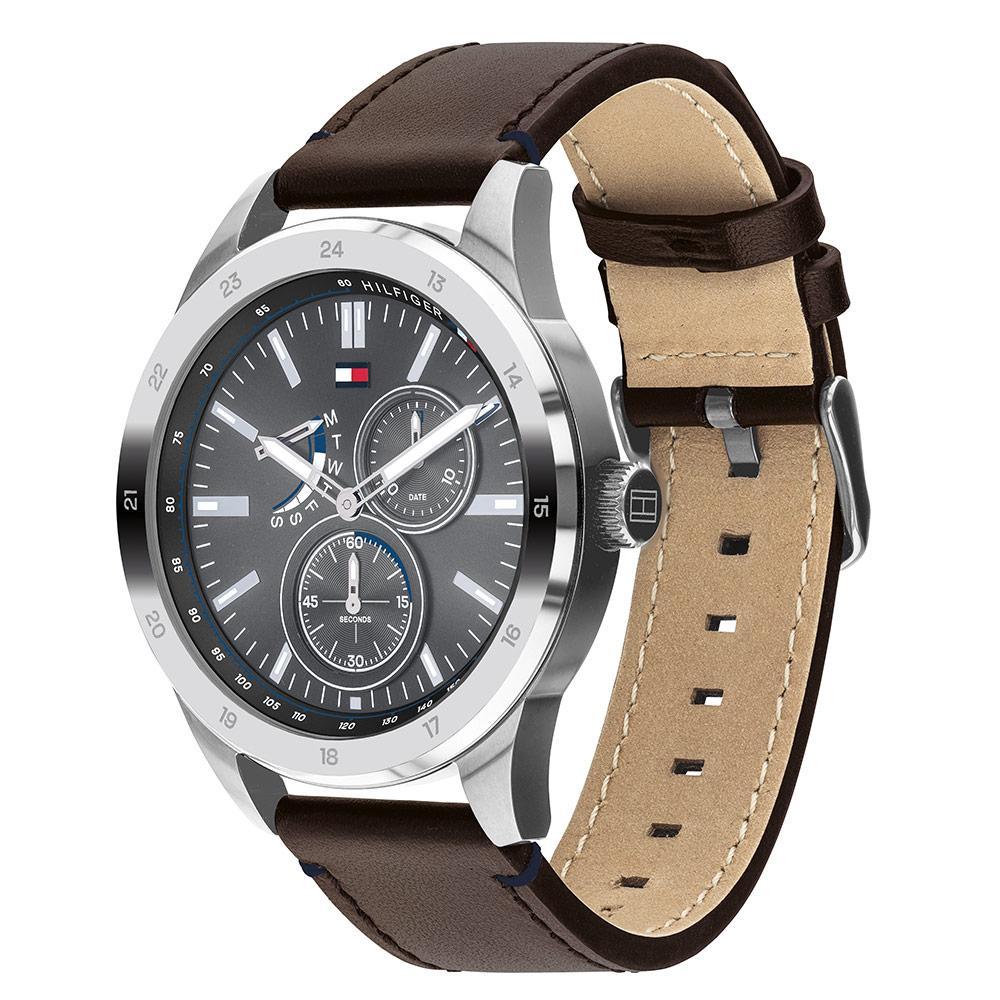 Side angle view showing brown leather strap with tan interior and stainless steel buckle