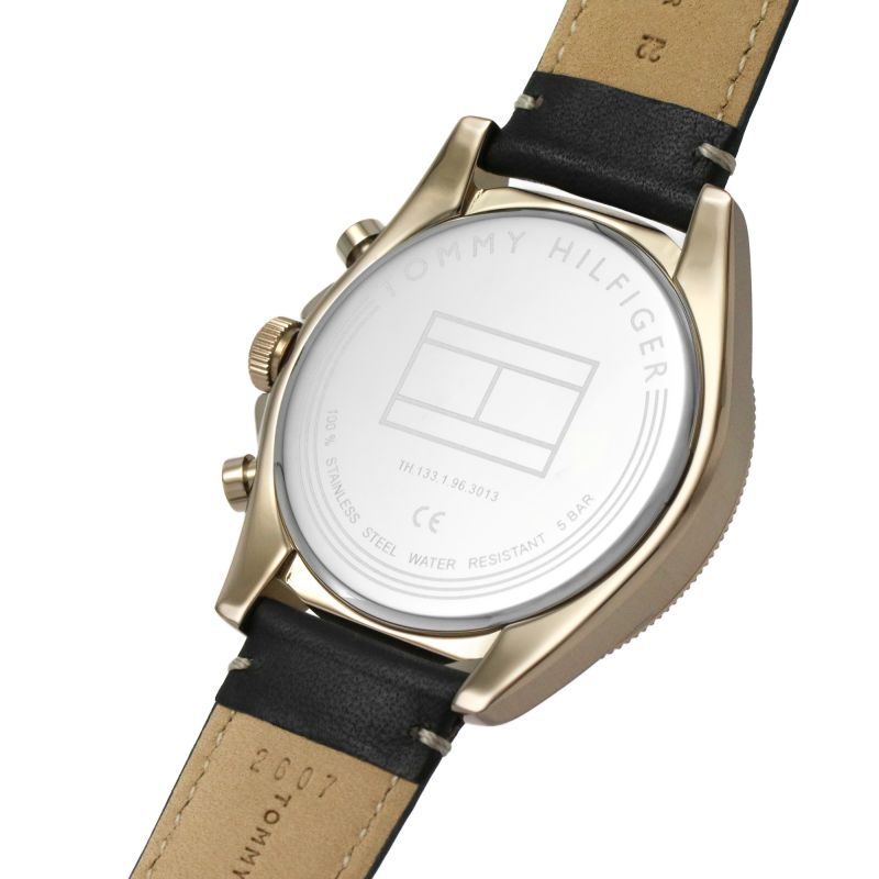Watch caseback detail showing Tommy Hilfiger engraved logo and water resistance rating