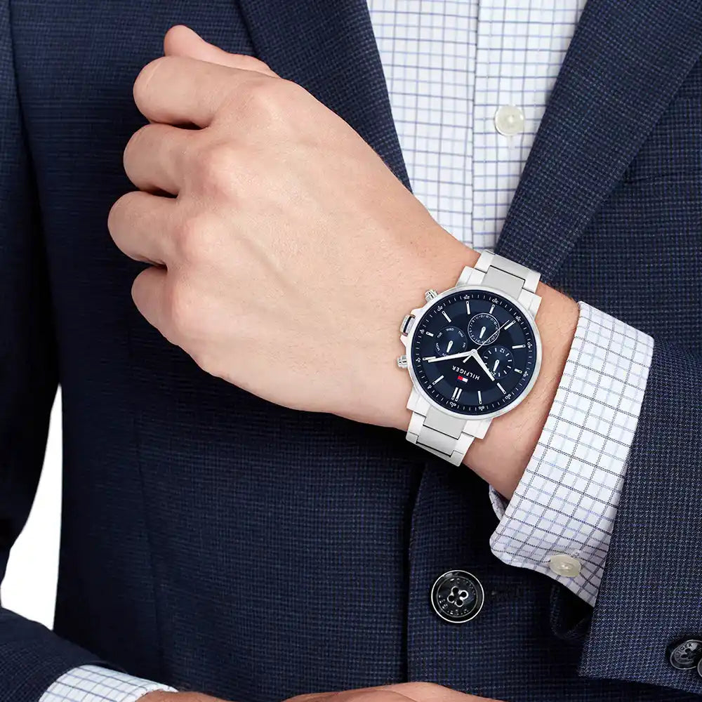 Tommy Hilfiger Tyson chronograph watch worn on wrist with blue dial and silver strap